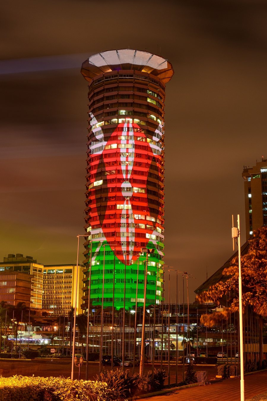 The KICC tower illuminated in Kenya's national colours at night